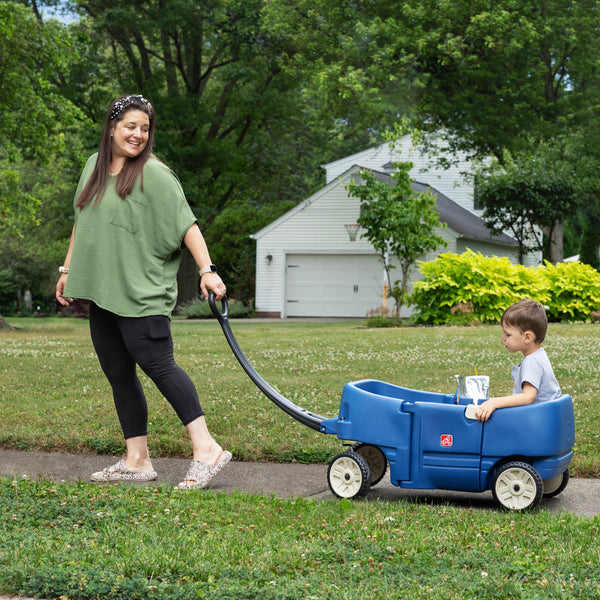 Wagon for Two Plus™ - Denim child being pulled in wagon