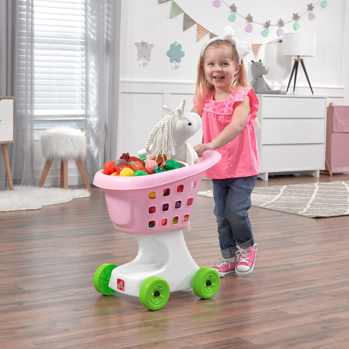 Little Helper's Shopping Cart™ - Pink with child pushing cart