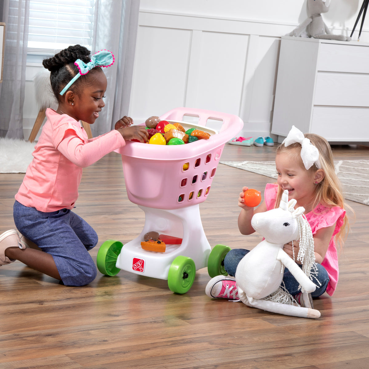 Little Helper's Shopping Cart™ - Pink with girls loading basket