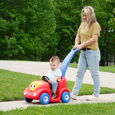 Push Around Buggy 10th Anniversary Edition™ - Red with child riding