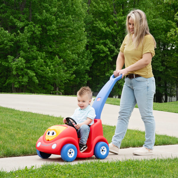 Push Around Buggy 10th Anniversary Edition™ - Red with child riding