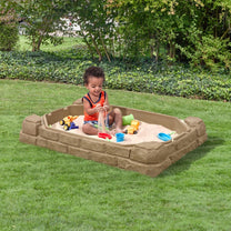 Naturally Playful™ Sandbox™ with child playing