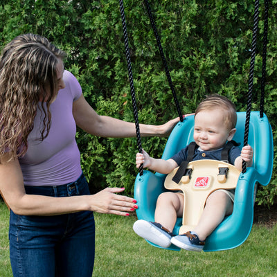 Infant to Toddler Swing™ - Teal with child seated in swing
