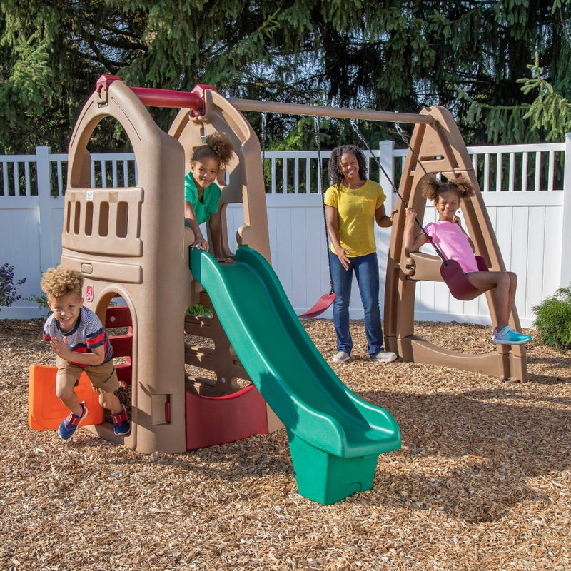 Naturally Playful™ Playhouse Climber & Swing Extension with kids playing