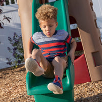 Naturally Playful™ Playhouse Climber & Swing Extension boy sliding