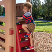Naturally Playful™ Playhouse Climber & Swing Extension boy climbing on ladder