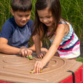 Naturally Playful™ Sand Table™ lid is an additional play surface with molded roadways