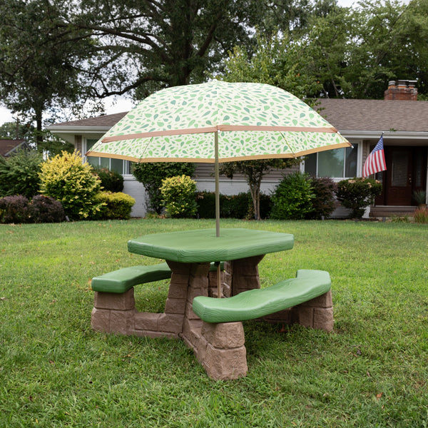 Naturally Playful™ Picnic Table with Umbrella™ - Leaf shown in yard