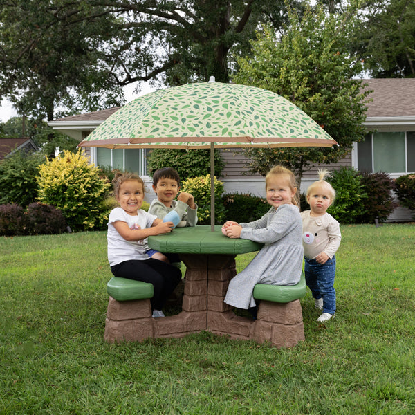 Naturally Playful™ Picnic Table with Umbrella™ - Leaf with children at table