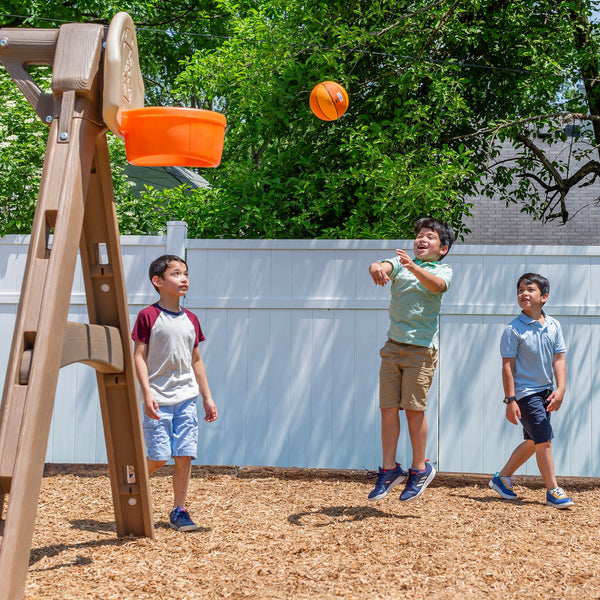 Naturally Playful™ Adventure Lodge Play Center boys playing basketball