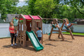 Naturally Playful™ Adventure Lodge Play Center with Glider kids playing