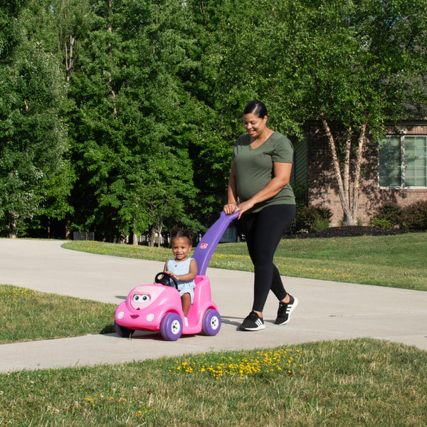 Push Around Buggy 10th Anniversary Edition™ - Pink with child riding