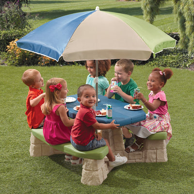 Naturally Playful™ Picnic Table with Umbrella™ - Earth with kids eating 