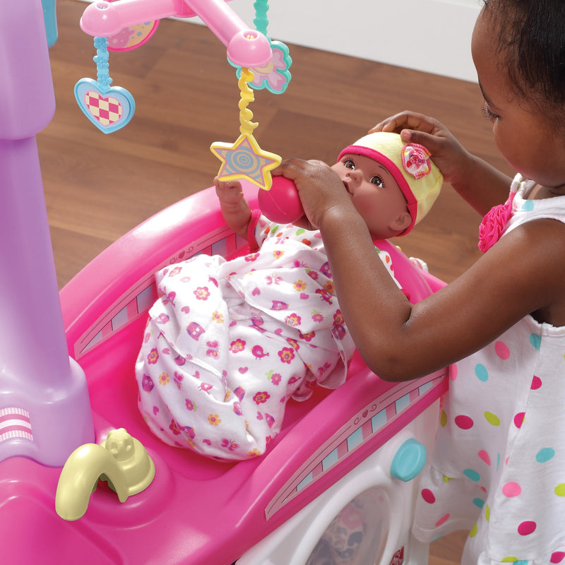 Love & Care Deluxe Nursery™ doll on changing table