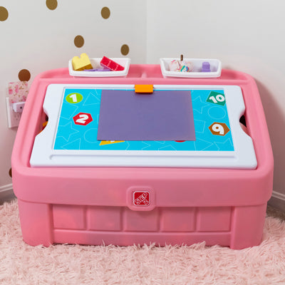 2-in-1 Toy Box & Art Lid™ art clip holds paper on lid