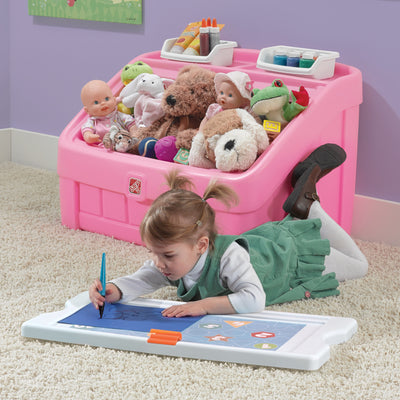 2-in-1 Toy Box & Art Lid™ child using lid as art board