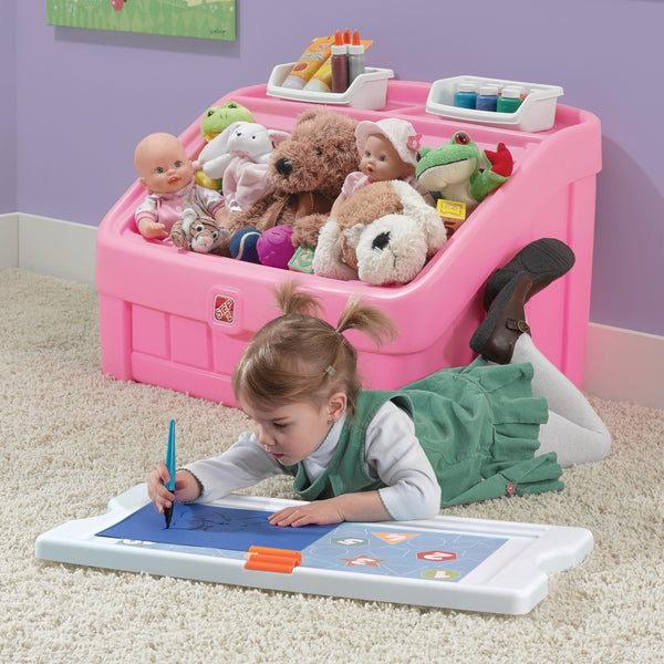 2-in-1 Toy Box & Art Lid™ child using lid as art board