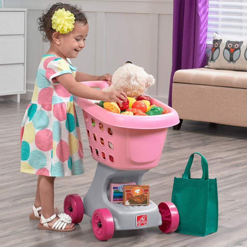 Little Helper’s Cart & Shopping Set™ - Pink with girl food shopping.