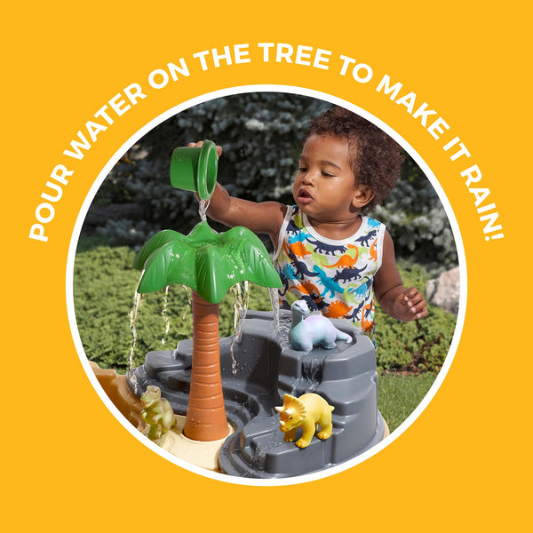 Dino Dig Sand & Water Table pour water on tree to make it rain