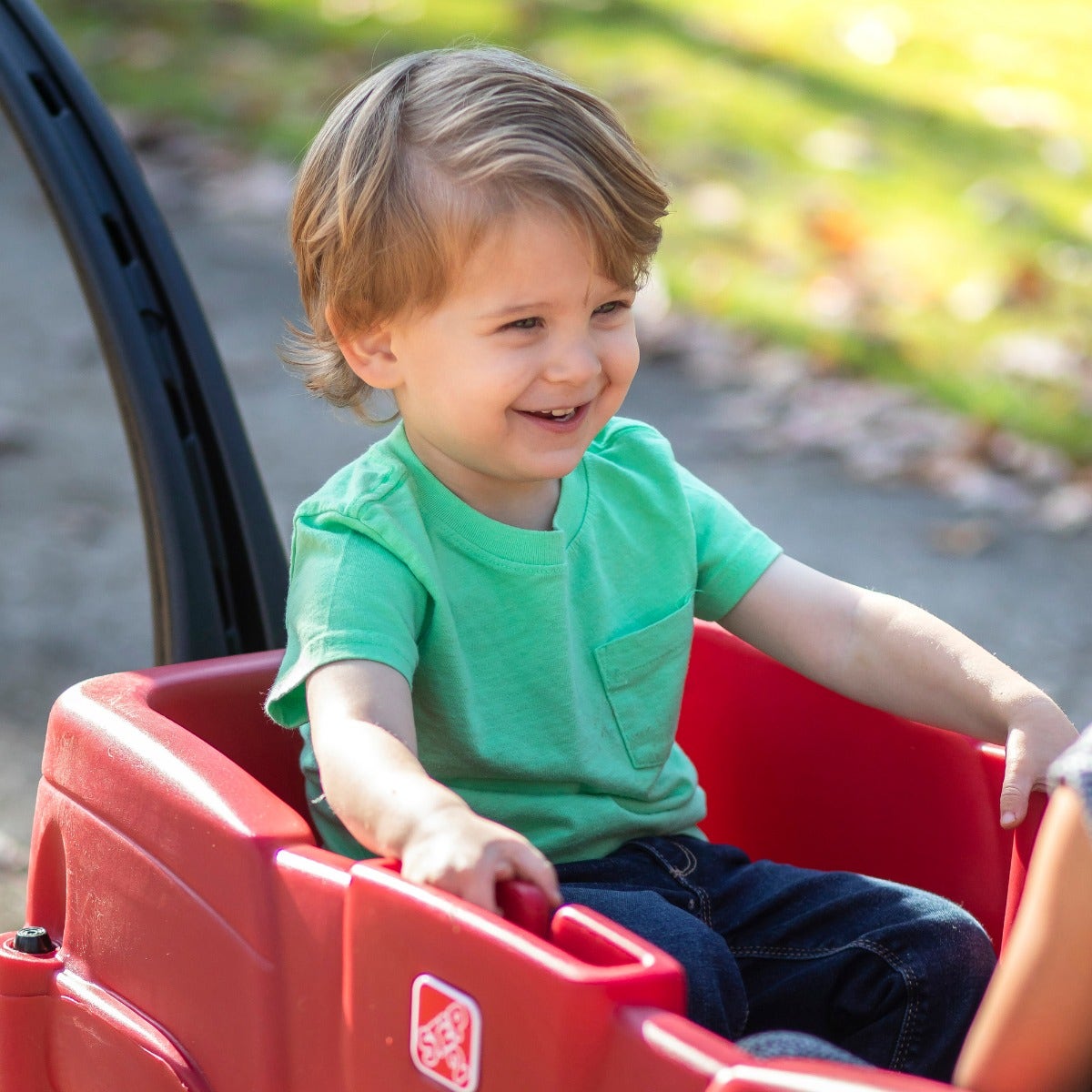 Neighborhood Wagon™ boy riding in wagon