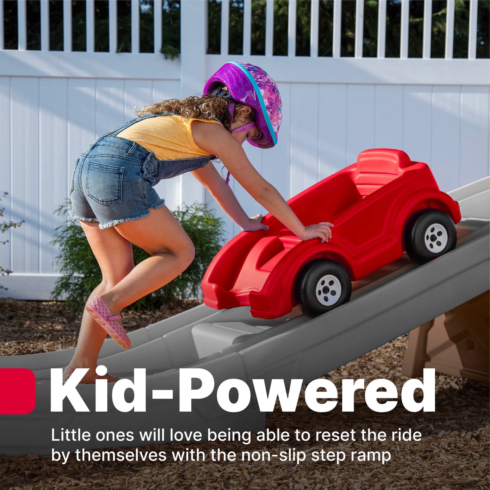 Extreme Thrill Coaster™ child pushing car up track on the non-slip step ramp